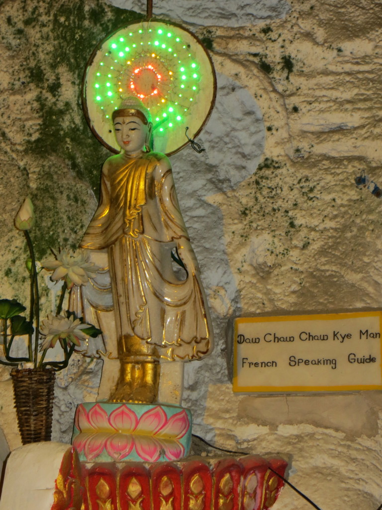 Many of the Buddhas have plaques telling who donated the statue. This one sure looks to me like it's an advertisement if you need a French tour guide!