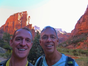 Here we are at the start of the hike. We didn't know then that the climb would take us up to the top of that rock behind Mark's head.
