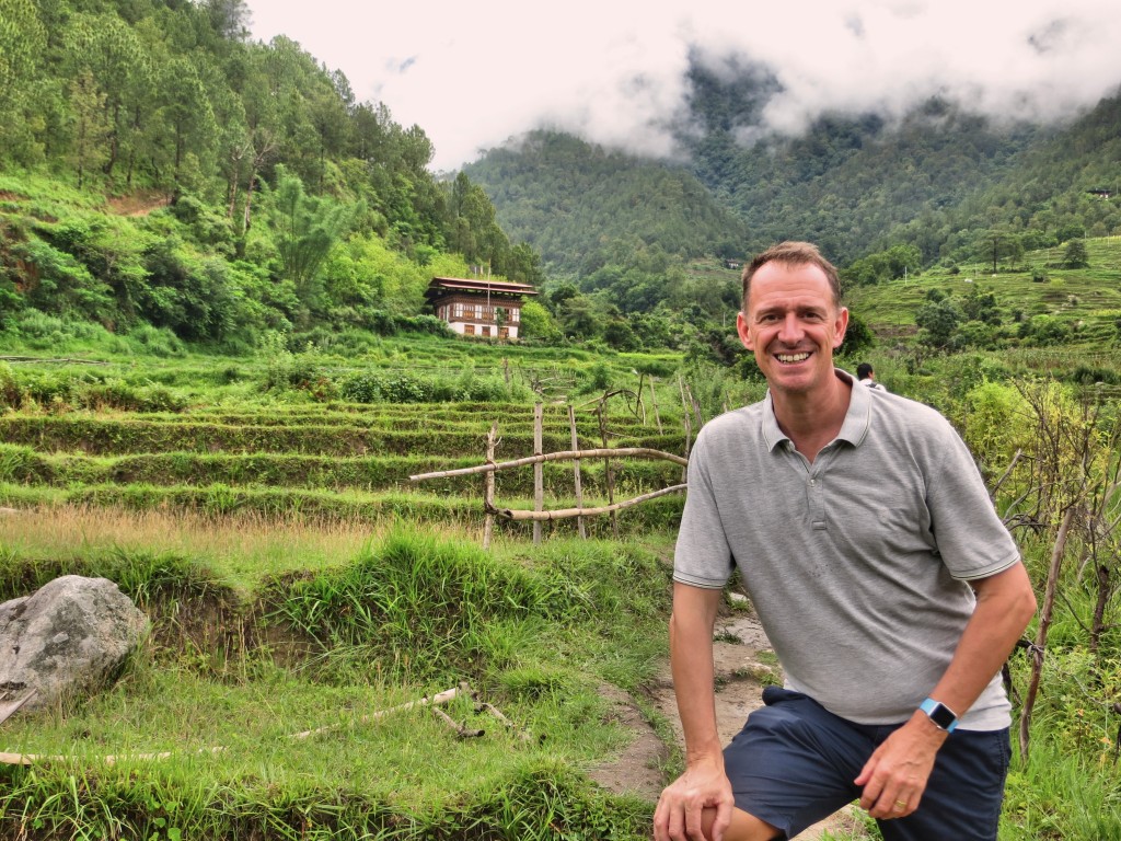 Mark on a hike through rice fields to a temple