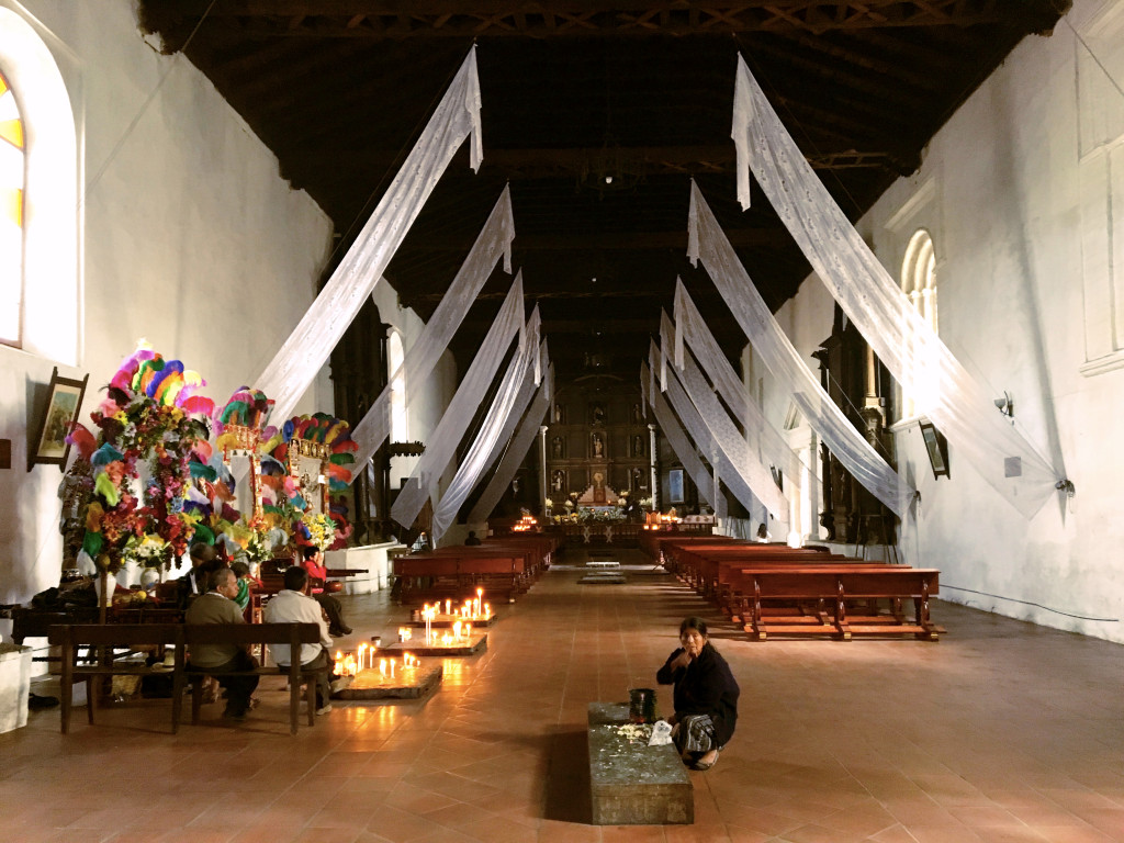 This is the picture I took inside the Church of St. Thomas; you can see the woman in the foreground telling me not to. Note the candles burning on small slabs, essentially on the floor, a unique placement in my experience at least.