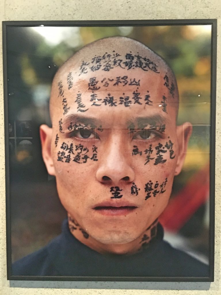 This is Zhang Huan, a contemporary Chinese Artist. He had three calligraphers spend a day writing on his face and neck relating family and traditional stories about fate. It starts slow until his entire head is just glossy black. You had to see it.