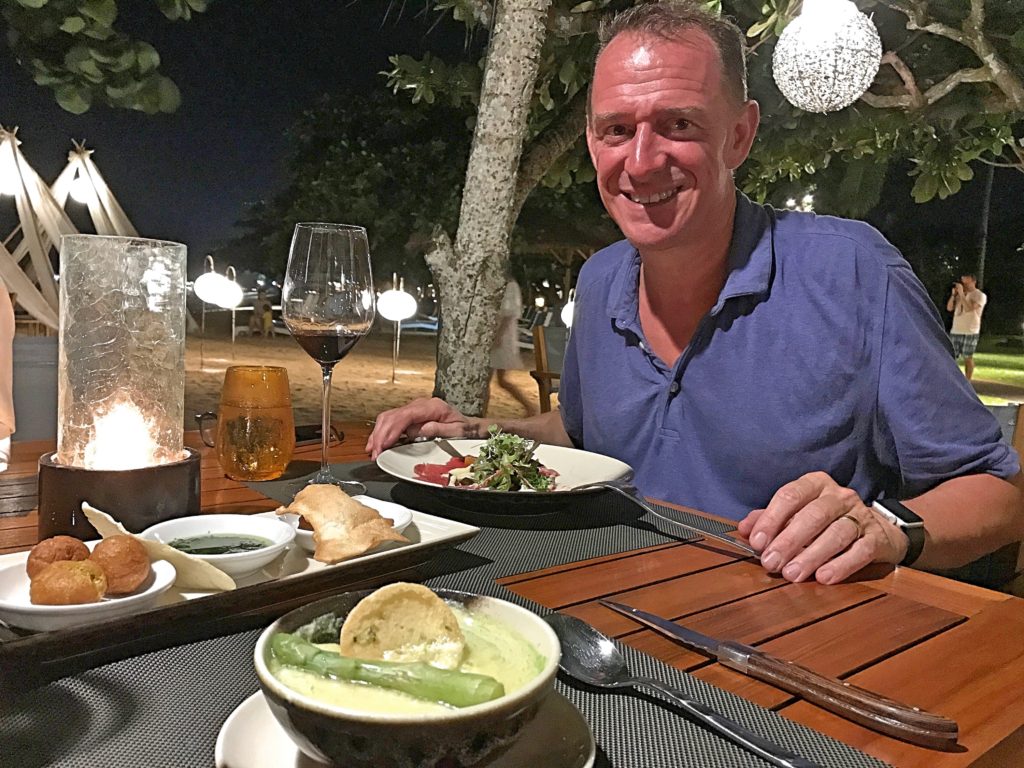 Dinner at the one genuinely good resort restaurant. That's an asparagus flan that I'm having while Mark is having beef carpaccio; both were excellent.