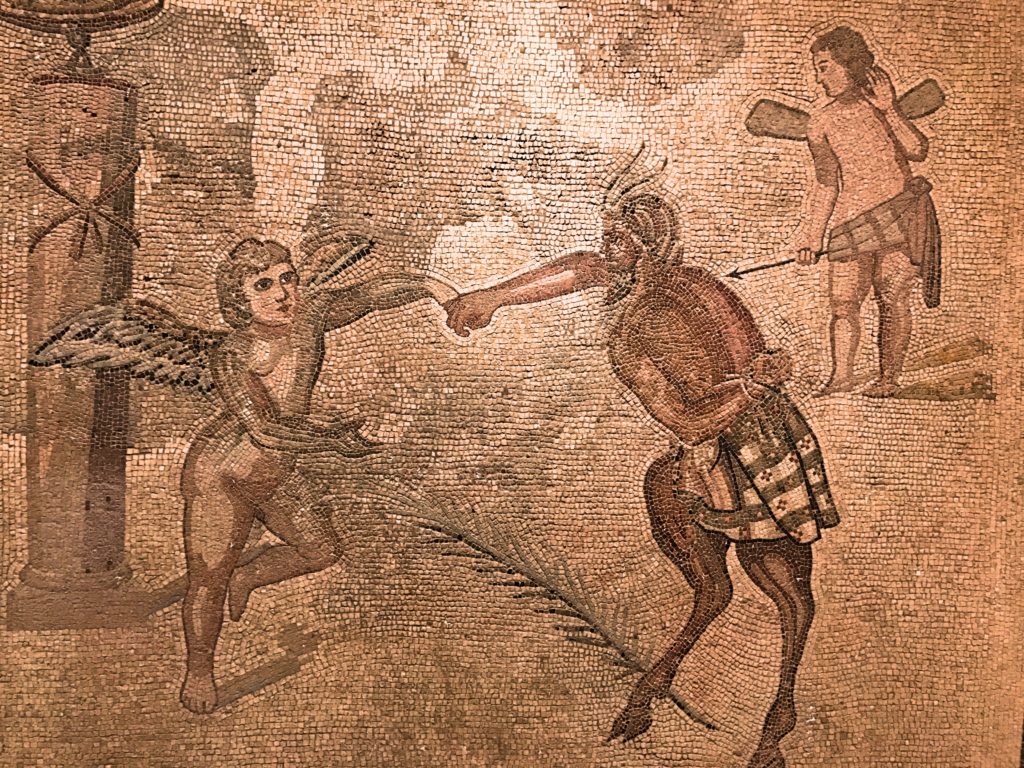 The Museo de Zaragoza includes both archeology and fine arts. Inexplicably, the rooms holding 15 Goyas was closed the day I was there - dark and roped off, though the art was definitely there - but the rest of the museum was still interesting. This ancient mosaic is titled Eros and Pan and appears to be the first fist bump in recorded history.